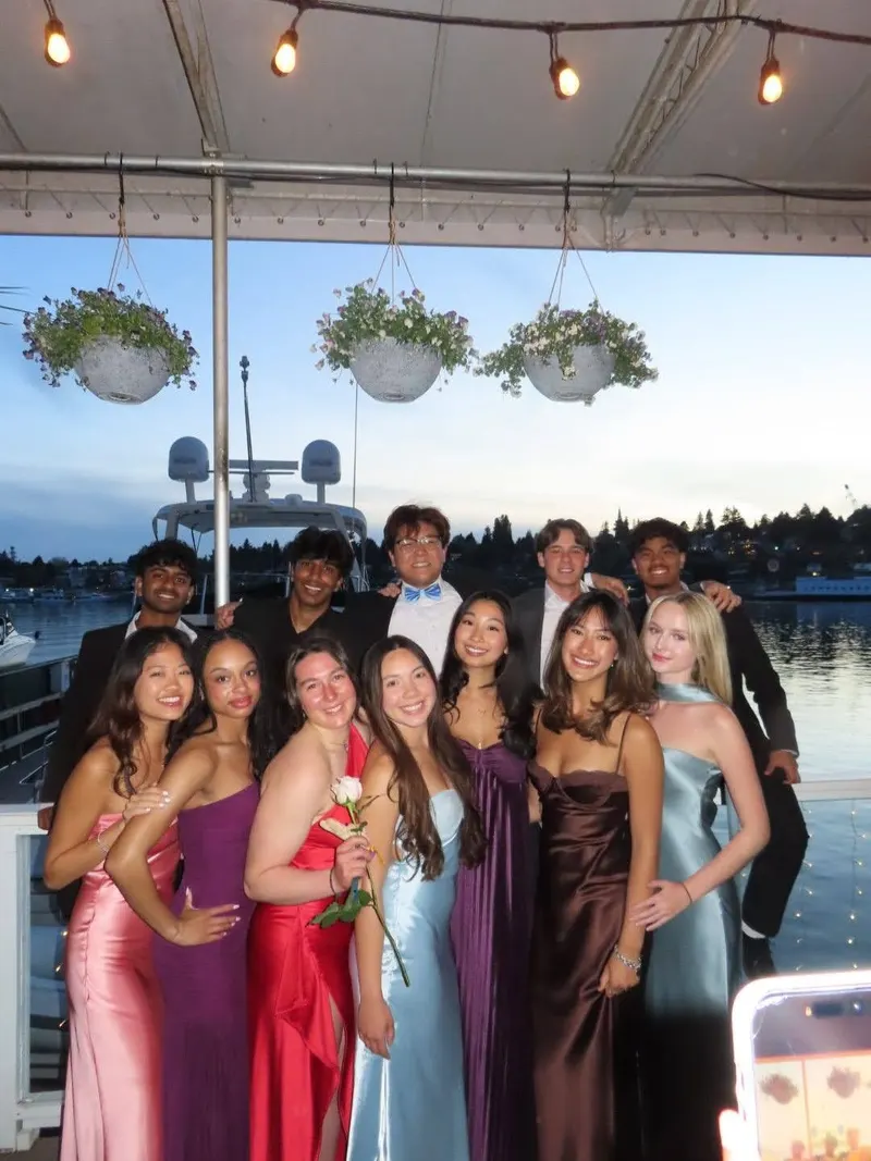 A group of brothers in formal wear on a waterfront deck