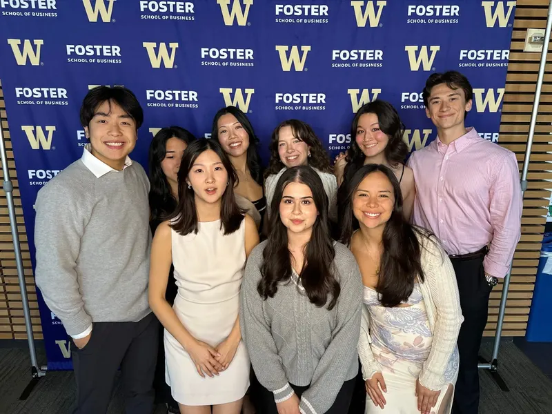 Brothers in front of a Foster School of Business backdrop